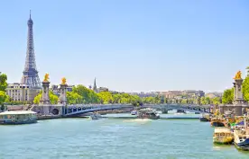 The Seine river with Alexandre III bridge and Eiffel Tower in the background