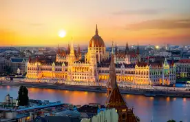 Parliament on riverbank of Danube at sunrise in Budapest, Hungary