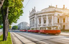 Wiener Ringstrasse with Burgtheater and tram at sunrise, Vienna, Austria