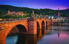 The old bridge in Heidelberg city and colourful evening sky in Germany