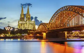Cologne Cathedral and Hohenzollern bridge illuminated in Cologne, Germany