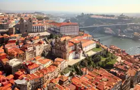 An aerial shot of the Porto Cathedrals next to the Douro River, Portugal
