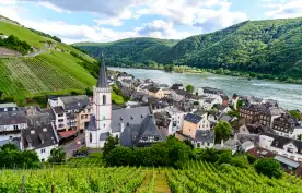 Church, houses and vineyards with the Rhein river in Assmanshausen, Germany