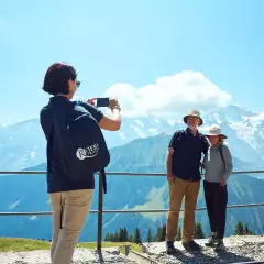 Riviera Tour Manager taking couples photo in Switzerland
