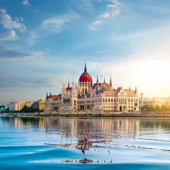 The Hungarian Parliament building over the Danube river at sunset in Budapest, Hungary