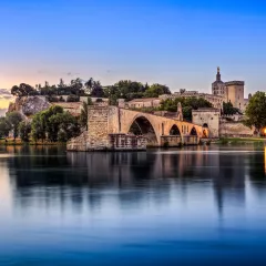 Avignon Bridge with Popes Palace and Rhone river in Pont Saint-Benezet, France