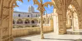 Hieronymites Monastery courtyard with church dome in background in Lisbon, Portugal