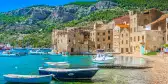 Komiža coastal town with boats on the island of Vis in South Croatia