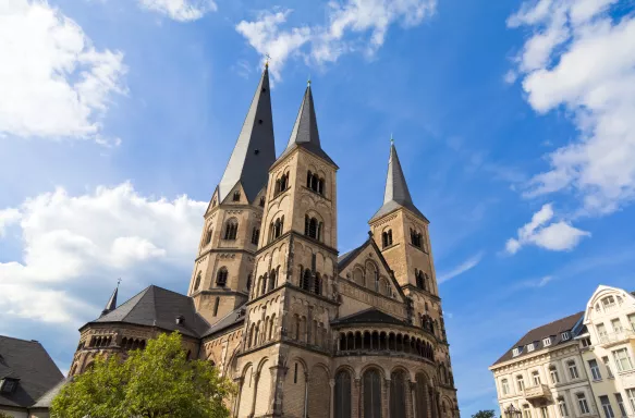 Street view of the steeples of Bonn Minster church, Germany