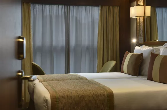 Double bed suite with evening lighting on the MS Douro Splendour