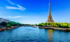 View of the Eiffel Tower and river Seine on a sunny day in Paris, France